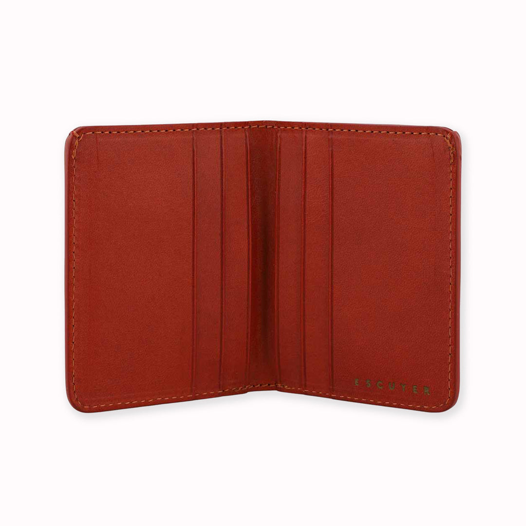Slim Italian leather wallet open view from Escuyer, featuring bright red and orange vegetable dyed colour tones for a subtle and stylish appearance - half and half on the outside, orange on the inside. Handmade by Portuguese artisans using leather from a tannery in Tuscany