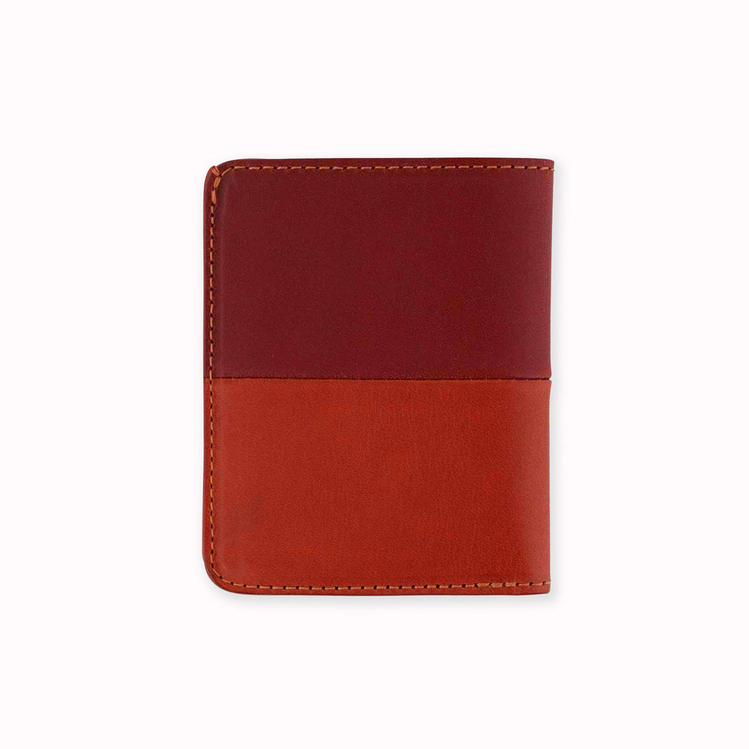 Slim Italian leather wallet rear view from Escuyer, featuring bright red and orange vegetable dyed colour tones for a subtle and stylish appearance - half and half on the outside, orange on the inside. Handmade by Portuguese artisans using leather from a tannery in Tuscany