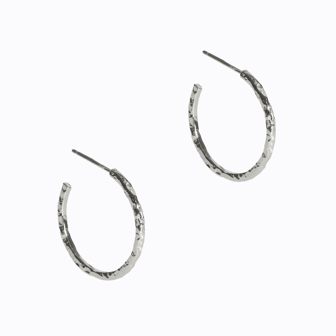 Solid silver hoop earrings with Matthew Calvin's signature meteorite texturing, these classic hoops catch the light beautifully and light and comfortable for everyday wear.
