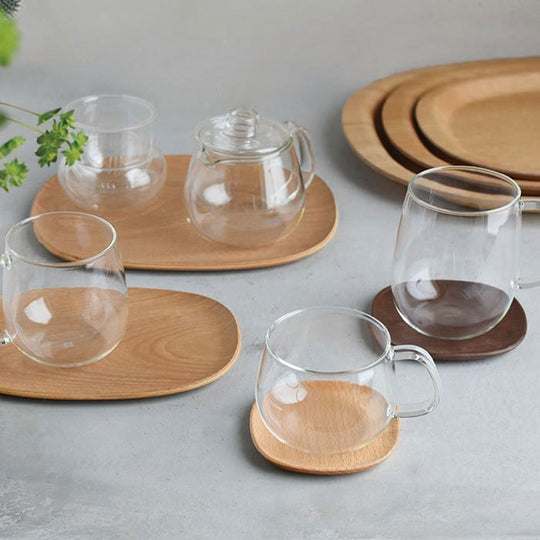 Unitea beech coasters, non-slip trays and teapots by Japanese brand Kinto
